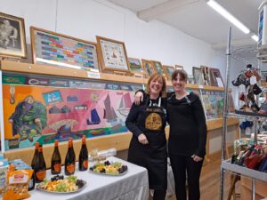Candy and Dawn serving drinks at exhibition